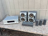 Group view of JVC receiver with six Sony speakers