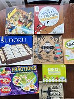 Eight boxed games laid out for overview