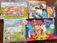 Box covers of all five games displayed