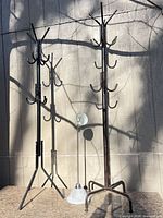 Full view of both coat racks and floor lamp