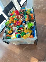 Top view of tote showing multicolour large bricks and several animal figures