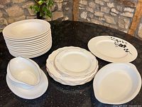 Overview of all dinnerware pieces on countertop