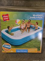Front of sealed Play Day 10-foot Family Pool box showing product image and branding
