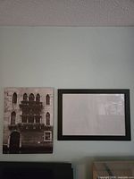 Overall view of both canvas print and black frame mounted on wall