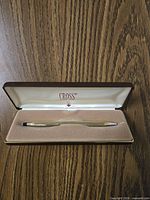 Pen displayed inside open Cross case