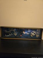 Full view of shadow box on surface