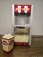 Front view of popcorn machine filled with popcorn