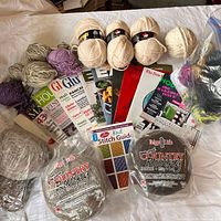 Full lot view showing all yarn, stitch book and magazines