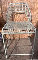 Front view of powder-coated steel mesh counter chair