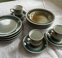 Stacked set showing cups, saucers, plates and bowls