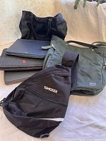 Group shot of all bags, cases and sling bag