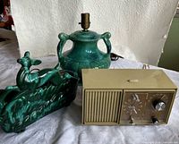 Group view of both green ceramic lamps and GE clock radio