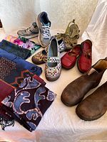 Group shot of all shoes and folded scarves