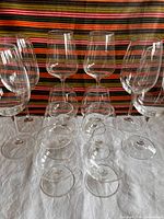 All twelve glasses grouped: 2 Vivo wine, 4 unmarked wine, 6 brandy