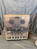 Front view of Akai GX-280D-S tape deck with cover and controls visible