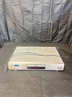 Front view of Curtis DVD 6500 unit with power cord displayed