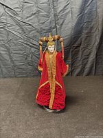 Front view of Queen Amidala doll on stand