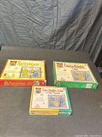 Three Catan series game boxes displayed
