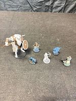 Full group of six miniatures on tabletop