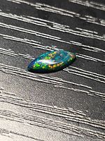 Marquise black opal cabochon showing play of color