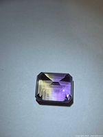 Front view of emerald-cut ametrine showing purple and yellow split