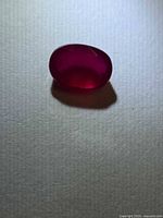 Front view of oval ruby showing color and shape
