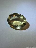 Front view of oval lemon citrine showing color and faceting