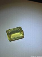 Emerald-cut lemon citrine front view under light