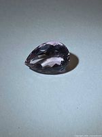 Front angled view of pear-cut amethyst