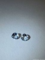 Front view of both aquamarine pear stones