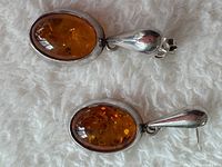 Full view of both amber drop earrings