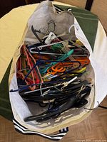 Top view of bag showing mix of plastic, wire, padded, and clip hangers
