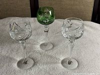 Front view of three Bohemian crystal stem glasses
