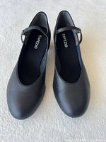 Front view of both shoes showing style, color, size indication inside