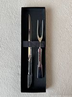 Knife and fork secured in black box