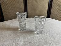 Both crystal vases side by side showing size comparison and patterns