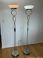 Full view of both torchiere lamps standing side by side