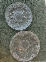 Two glass plates showing size difference and dancing couples design