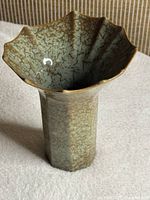 Top and side view showing scalloped rim and glaze finish