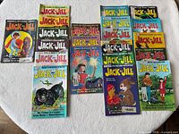 Front covers of 11 Jack & Jill magazines arranged on table