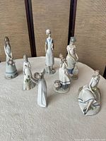 Group shot of all seven Lladro female figurines