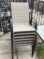 Stacked view showing 6 chairs, metal frames, sling seats
