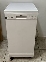 Front view of Danby portable dishwasher showing full unit on casters