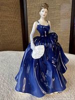 Front left three-quarter view of Sophie figurine