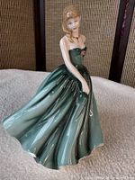 Front view of Royal Doulton Sarah figurine showing dress and pose