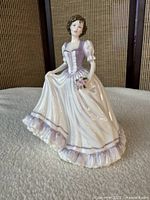 Front view of Royal Doulton "Suzanne" figurine showing full gown and bouquet