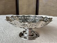 Side profile of footed pierced bowl