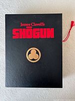 Front of black box with Shogun title and crest