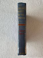 Spine view showing title, author and publisher, gilt lettering, shrink wrap present