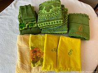 Overview of all assorted towels laid out on table